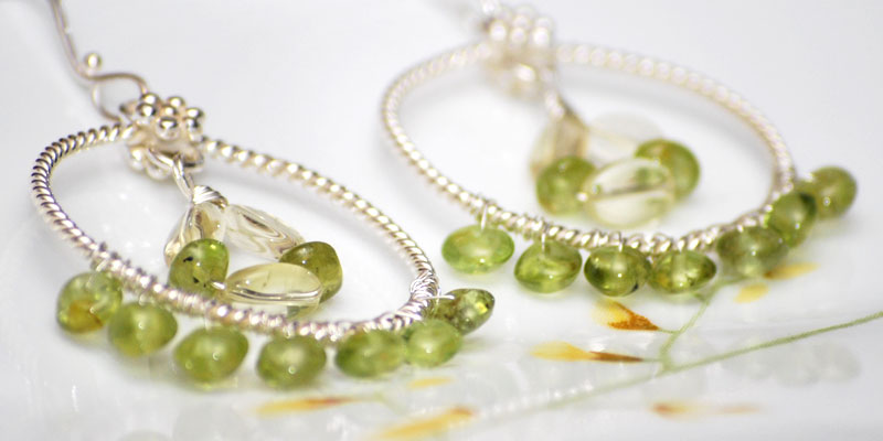 peridot rondelles wrapping around sterling silver circles